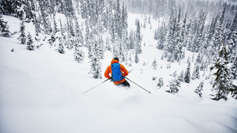 man-skiing-though-fresh-snow-while-on-backcountry-ski-tour-641463492-5ac19689119fa80037263339